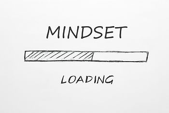Text "MINDSET LOADING" above a hand-drawn loading bar partially filled. White background, simple and motivational theme.