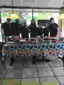 A group photo of Vinny's Pizzeria employees on the grand opening of the establishment