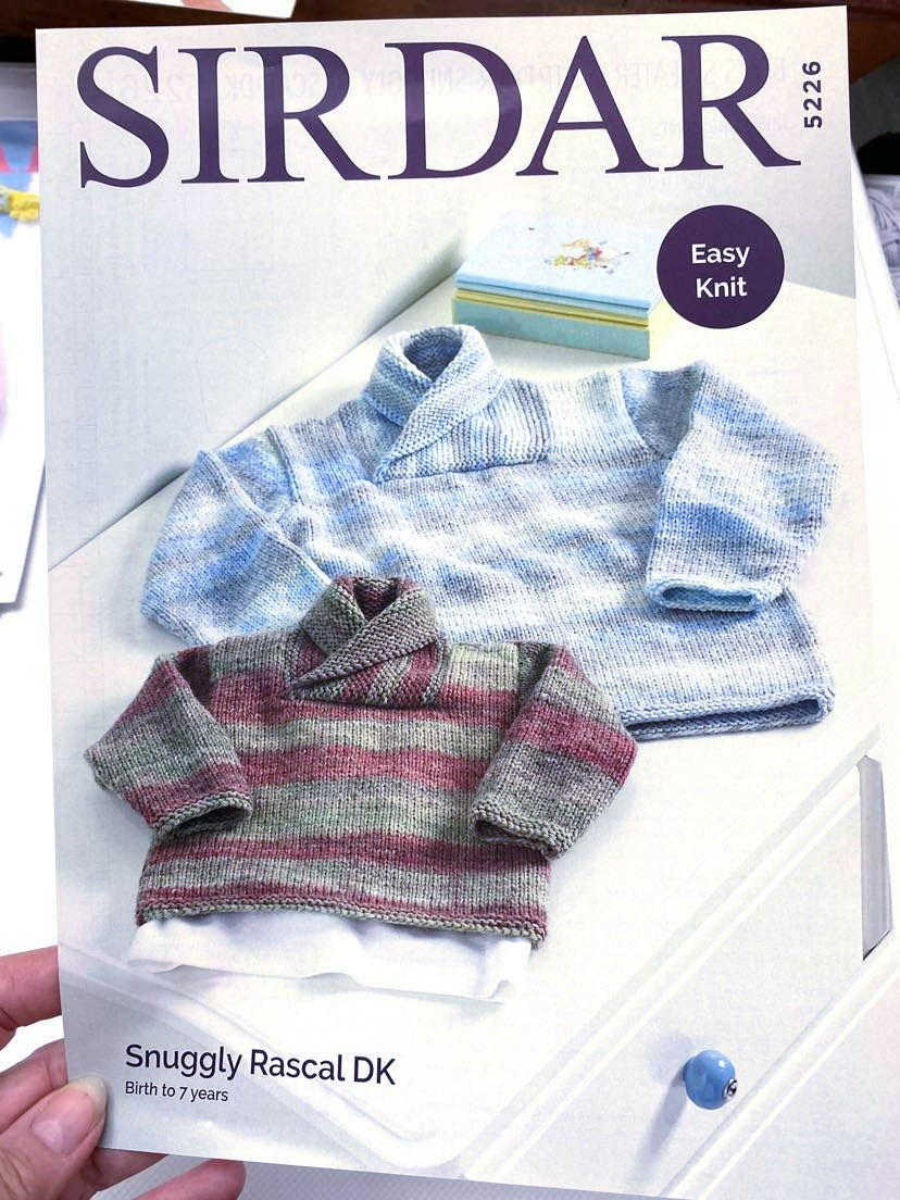Front Cover of Sirdar Knitting Pattern Leaflet 5226 - 8ply of 2 Jumpers with Wrap Neck Collars