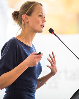 Pretty, young business woman giving a pr