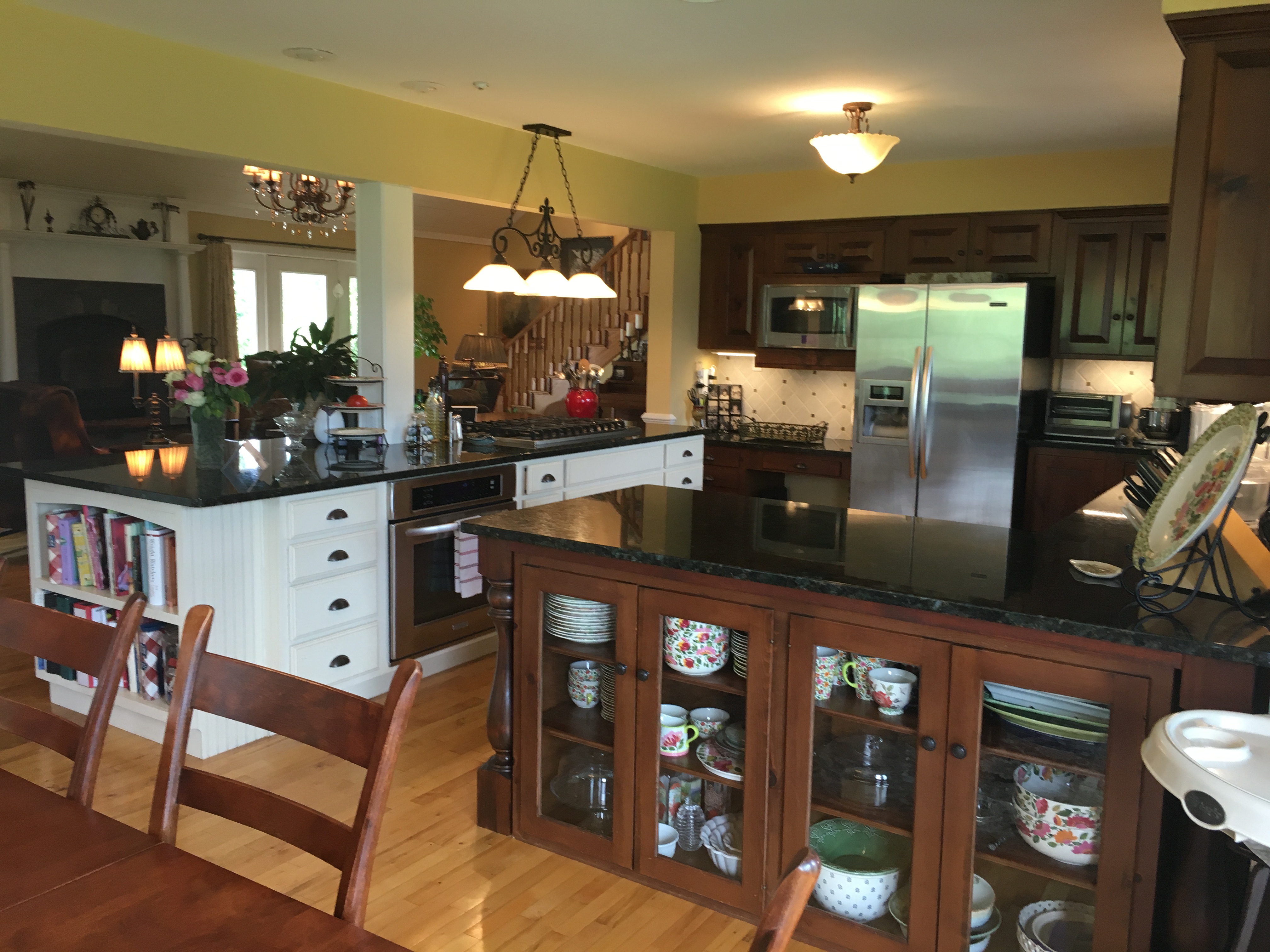 view of large country kitchen open to the great room, dining room, and sun room