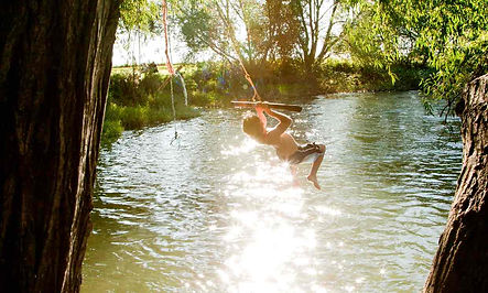 a rope swing over the river on The Norfolk Broads