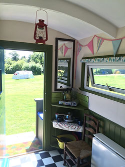 inside the Suffolk hay cart / shepherds hut at swattesfiel campsite