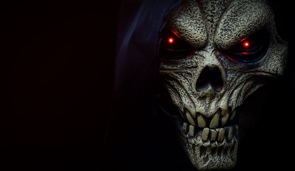 Close-up of a demonic skull with glowing red eyes and jagged teeth, set against a dark background—capturing the fearsome intensity and supernatural horror of classic evil imagery.