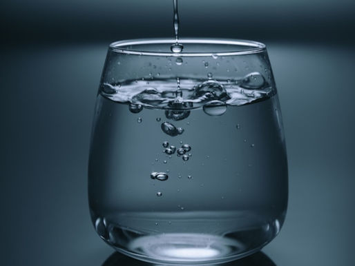 Glass being filled with water