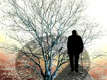 Old man wandering towards the setting sun