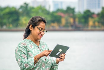 Woman reading Only Good News Daily on her reading device