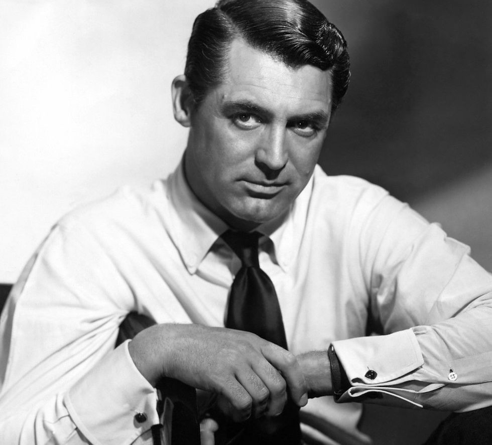Cary Grant wearing a white shirt and a dark tie in the 1940s