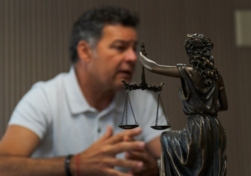 Small bronze statue of the scales of justice