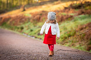 Child walking along a path in her winter clothes
