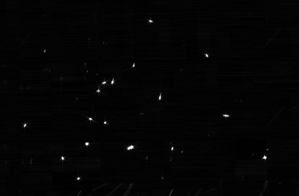 Black, deep space with 18 white dots.