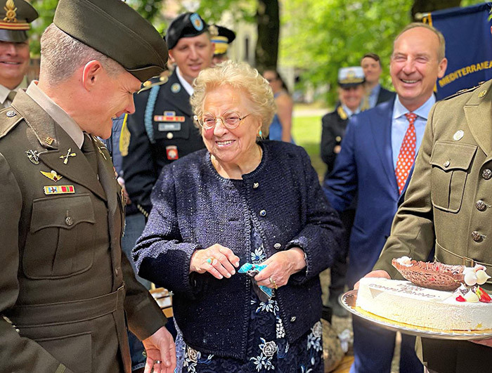 Meri Mion pictured between two US soldiers