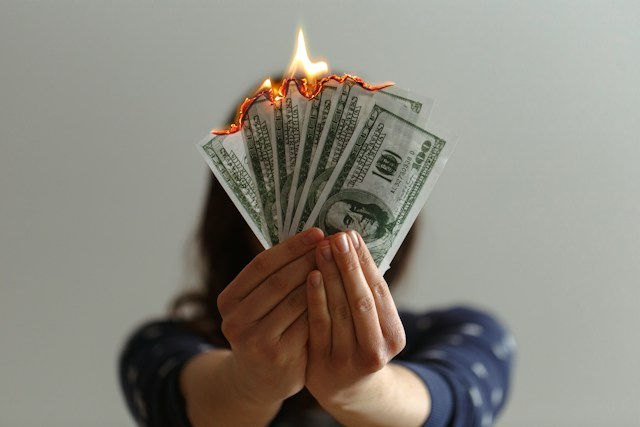 Pile of bank notes burning