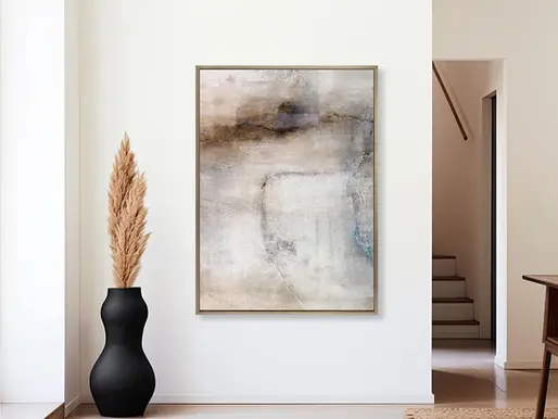 Abstract painting hanging in a light-filled hallway