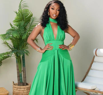 Woman wearing an emerald green satin dress