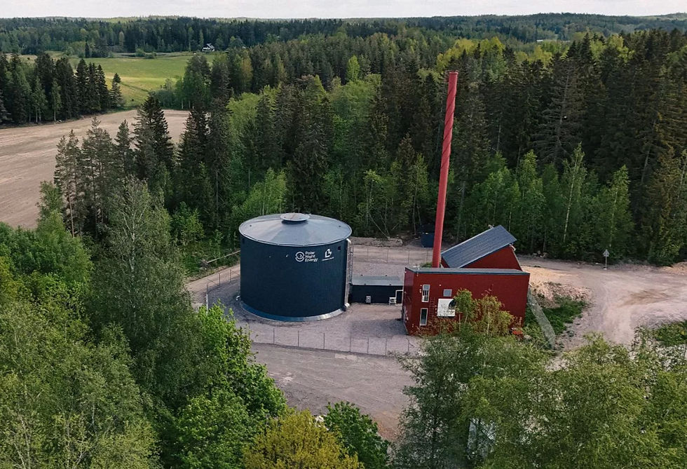 13 meter tall sand battery tower in a forest clearing