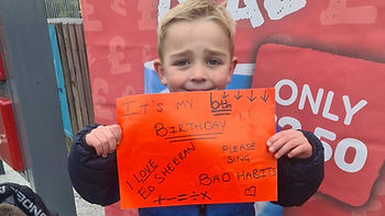 Daniel Keating holding up his sign for Ed Sheeran