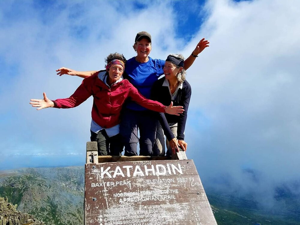 Kristy Burns, Annette Demel and Lynn Edmiston on a mountain top.