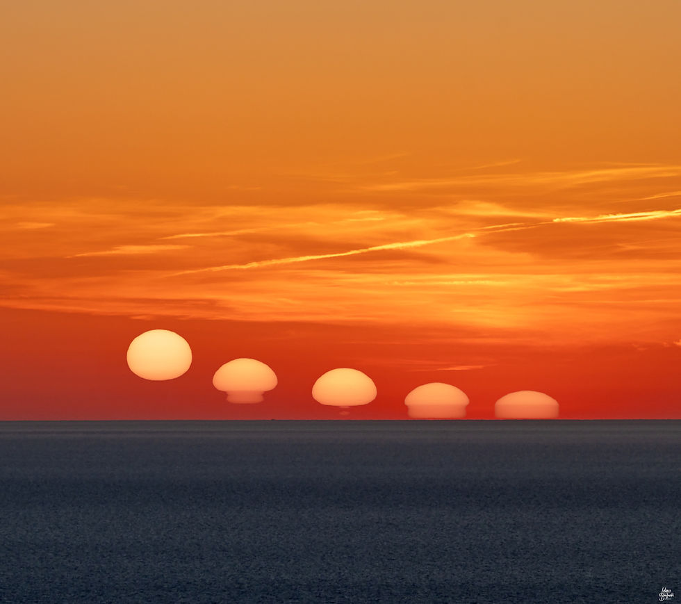 Sun setting across the ocean