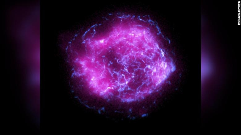 Bright pink swirly image of a supernova in space.