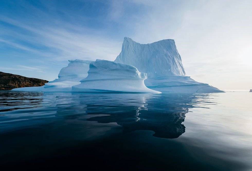 Three little icebergs in the Arctic Ocean