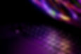 Partially open laptop reflecting light on the keyboard