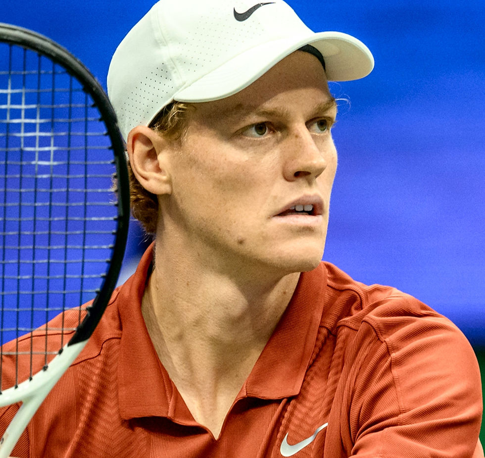 Jannik Sinner concentrating intently on court as he prepares for his next shot