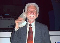 Marty Cooper holding the first mobile phone