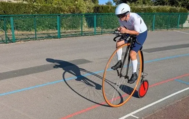 Richard Thoday riding a penny farthing
