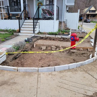 Lawn dug up and prepared for new planting
