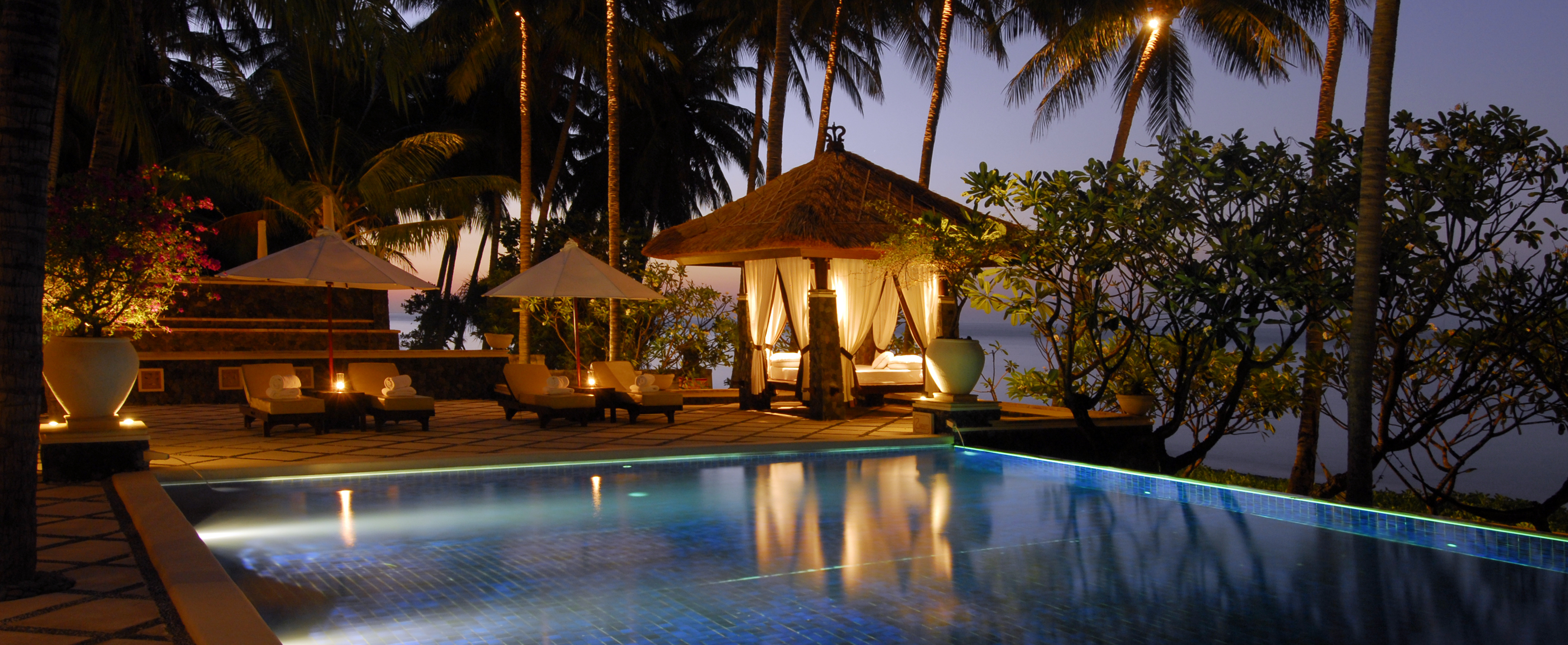 Luxury Bali hotel entrance with private transportation and welcome amenities