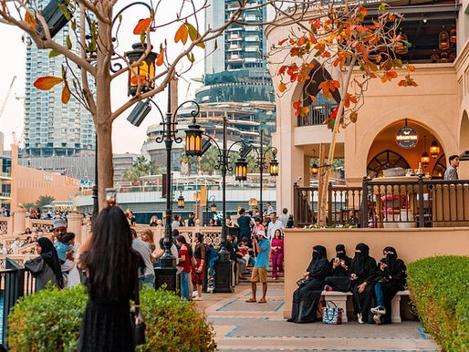 People congregating beside a harbour in Dubai