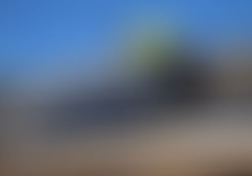 Man installing a solar panel on the roof of a home