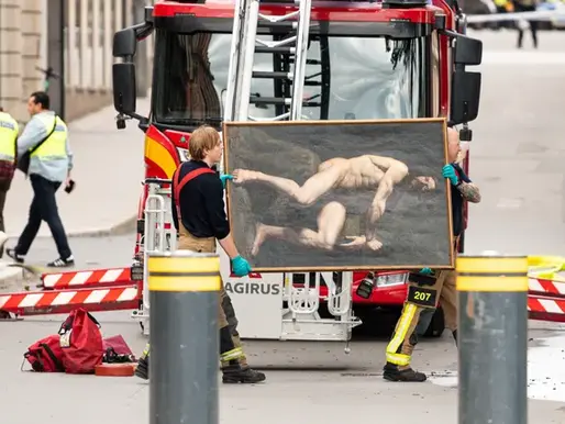firefighters rescuing historic artwork from a blaze in central Stockholm