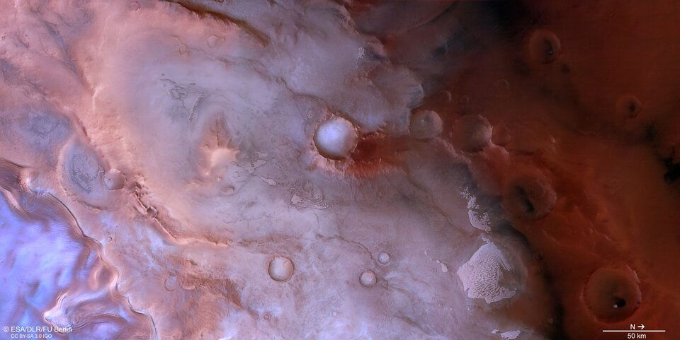a pink berry-toned ice cliff near the south pole on Mars