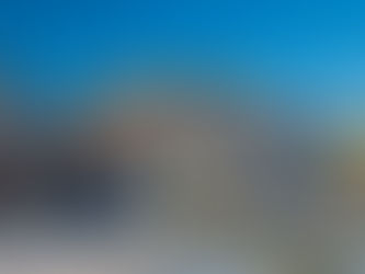 Workmen installing a new roof on a house