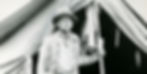 Hiram Bingham standing outside his tent