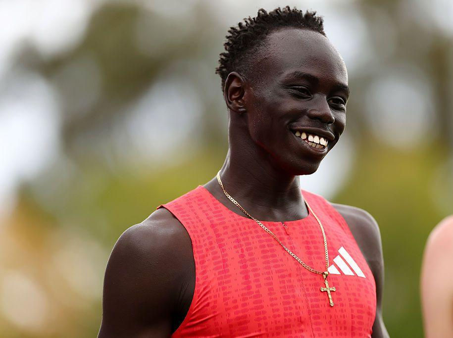 Gout Gout wearing a red running shirt