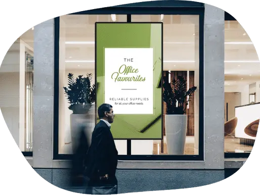 Digital sign in a store window advertising office supples