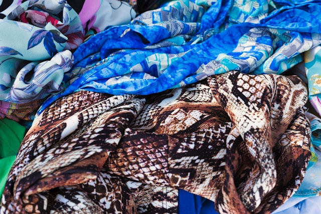 A pile of colourful fast-fashion clothing