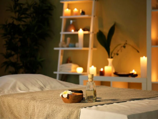 Massage room lit by numerous candles