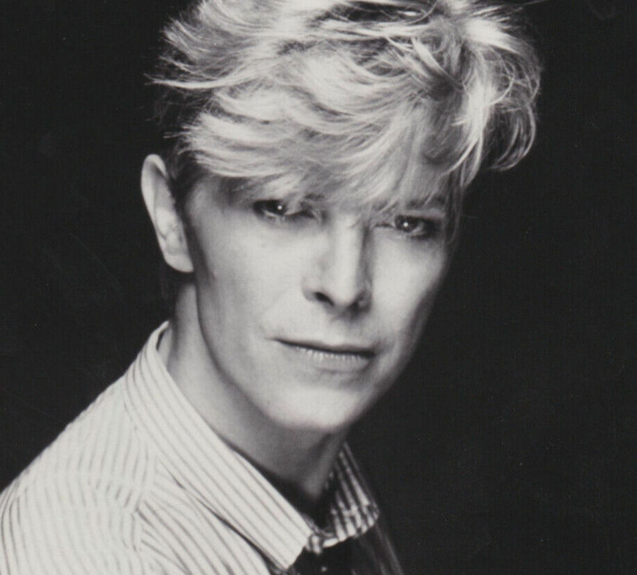 David Bowie in 1983 wearing a striped shirt