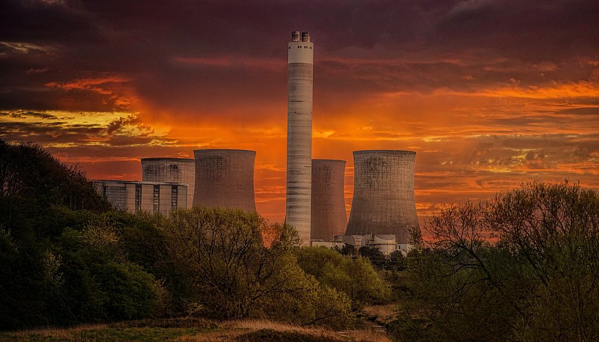 Three giant coal power station chimney stacks