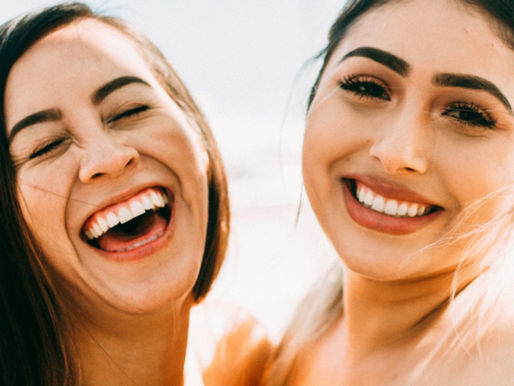 Two women hugging and smiling