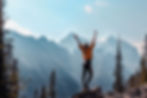Woman standing on a mountain top
