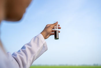 Scientist holding a vial
