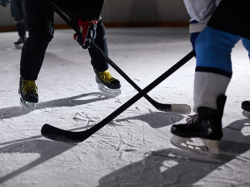 Ice hockey stick and puck