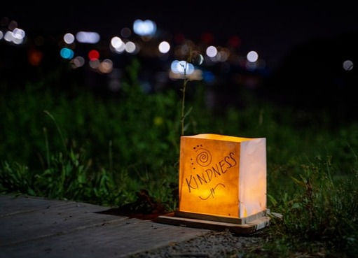 Paper lantern with the word kindness inscribed on its side