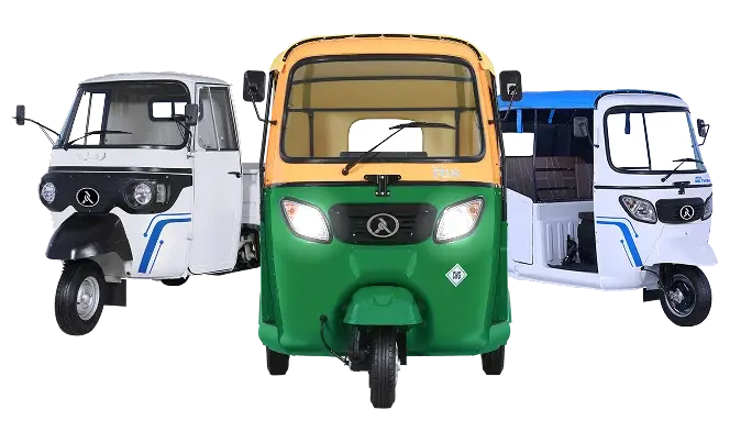 A green and yellow three-wheel electric tuk-tuk