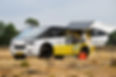sleek, futuristic-looking, white and yellow solar-powered ambulance